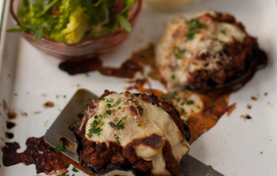Brown mushrooms topped with mince and cheese sauce