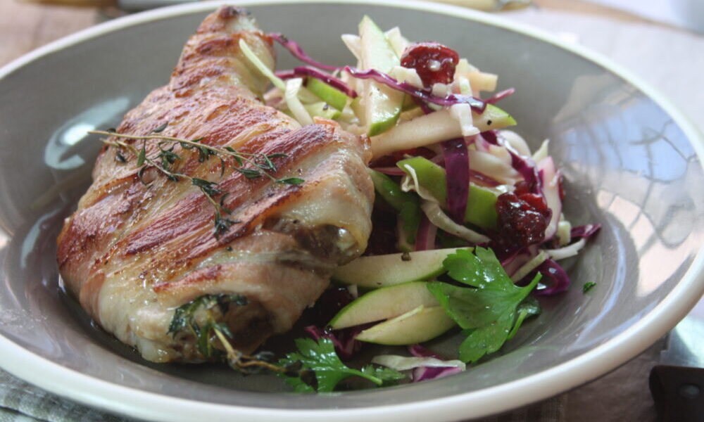 Succulent Pork Chops Wrapped in Bacon with Apple and Cranberry Slaw
