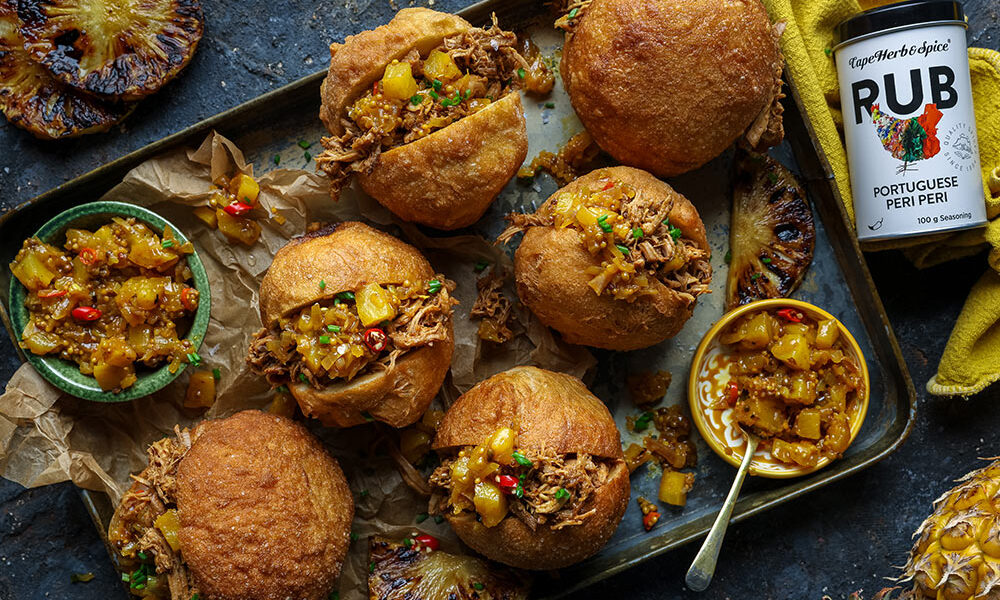 South African Heritage recipes. Peri Peri Pulled Pork Vetkoek with Braaied Pineapple Atchar for Cape Herb & Spice and SA Pork. Image by Crush Online